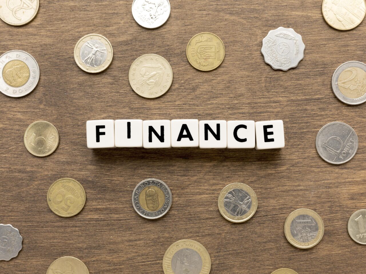 https://www.centroservizitf.it/wp-content/uploads/2026/07/finance-word-written-scrabble-letters-coins-1280x960.jpg